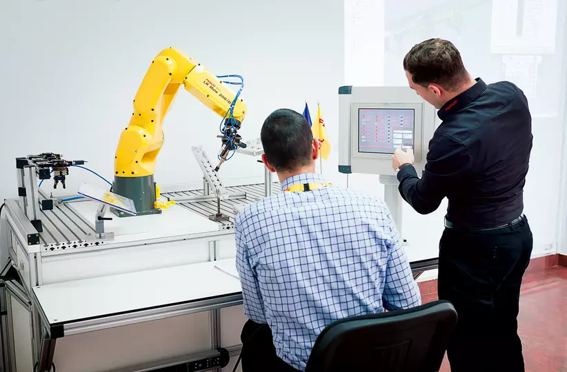 FANUC Trainer in the FANUC Academy is teaching a customer