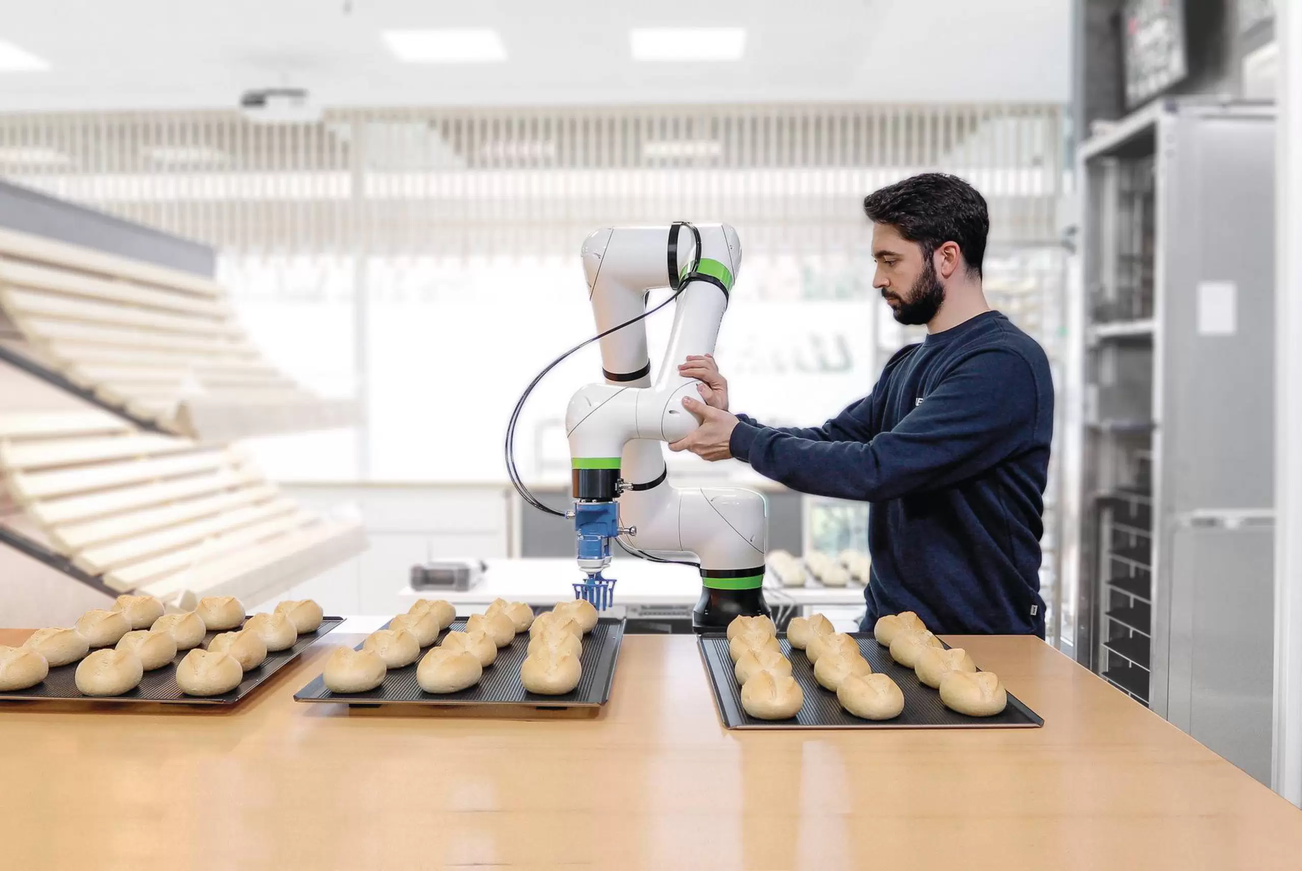 Employee collaborating with FANUC CRX robot