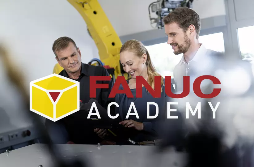 3 people in a service training with FANUC academy logo