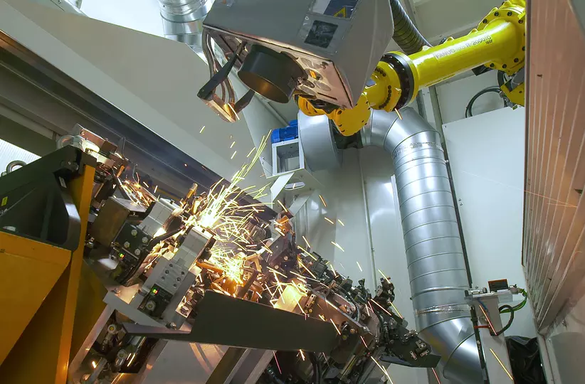 FANUC R-2000iC industrial robot and Arc Mate 100iD arc welding robot boosting the production of car seat structures at Brose Sitech.