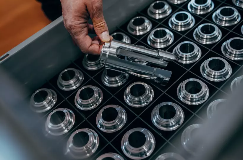 Finished parts for pressing tools, unloaded from the lathe with a FANUC CRX cobot at Emerson Professional Tools AG.