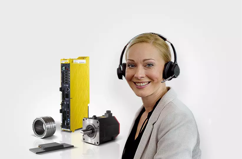 FANUC portal image. Lady with headset and FA parts in the background.