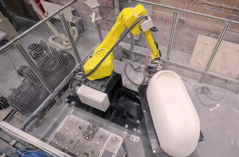 FANUC robot M-710iC/50 performing finishing operations, like grinding and polishing, at Metalac Inko. Installing this robotic cell, multiplied production, ensured repeatable process and with that improved finishing quality.