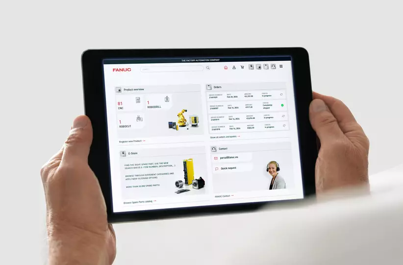 Image of FANUC Portal. 
Hands holding a tablet showing FANUC Portal home screen (product overview, orders, E-Store, Contact)