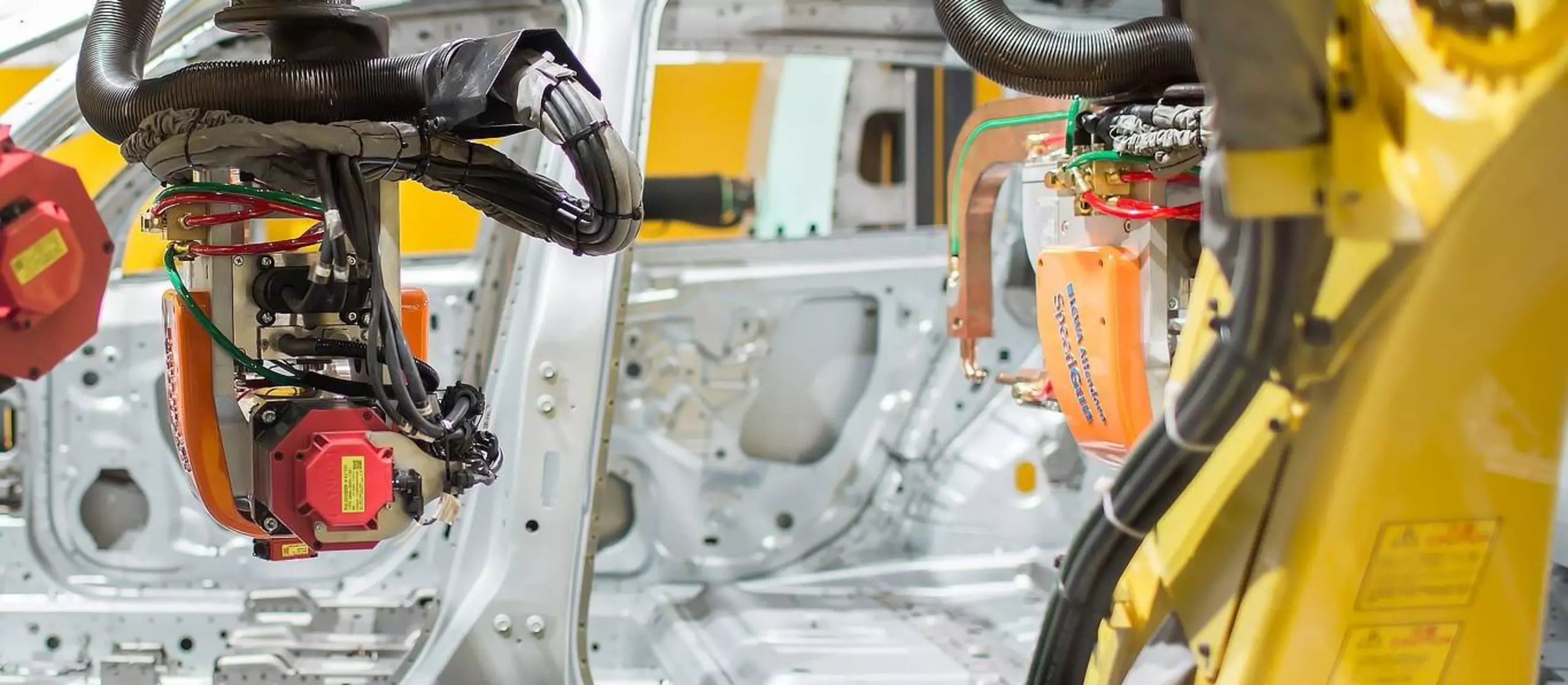 Image of two robots assembling a car at EMO 2017