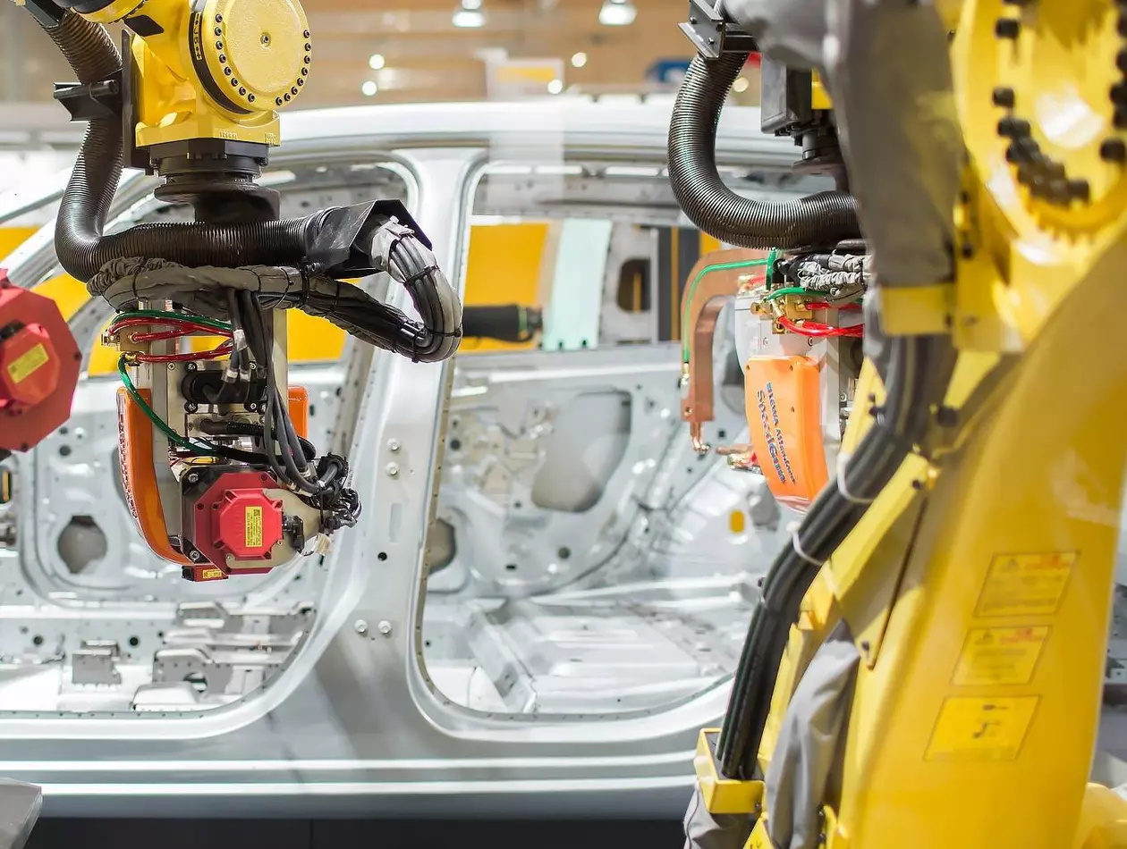 Image of two robots assembling a car at EMO 2017