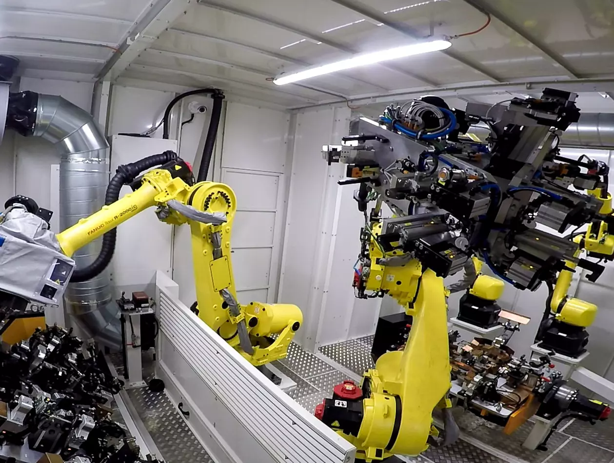 FANUC R-2000iC industrial robot and Arc Mate 100iD arc welding robot boosting the production of car seat structures at Brose Sitech.