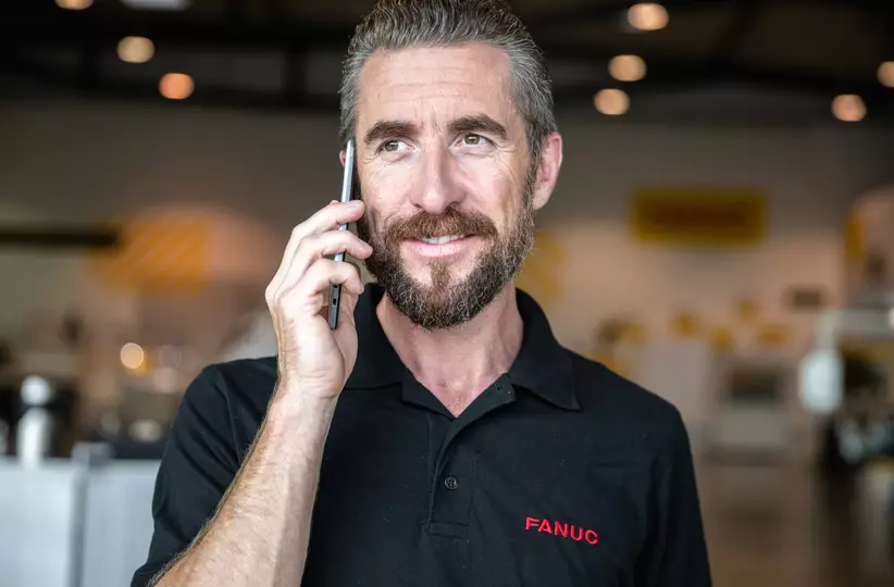 Service / maintenance photo with person. Man with mobile phone. Landscape. High resolution.