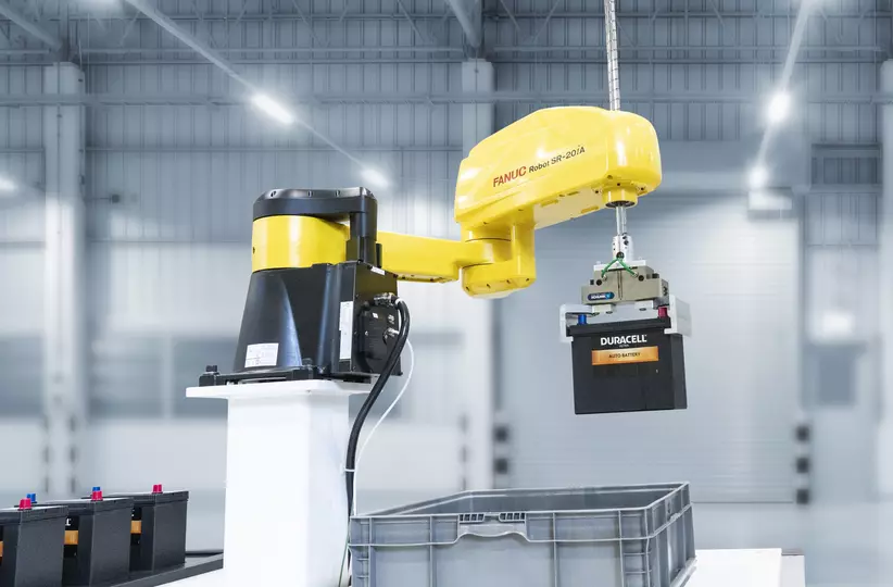 FANUC SCARA SR-20iA handling batteries.