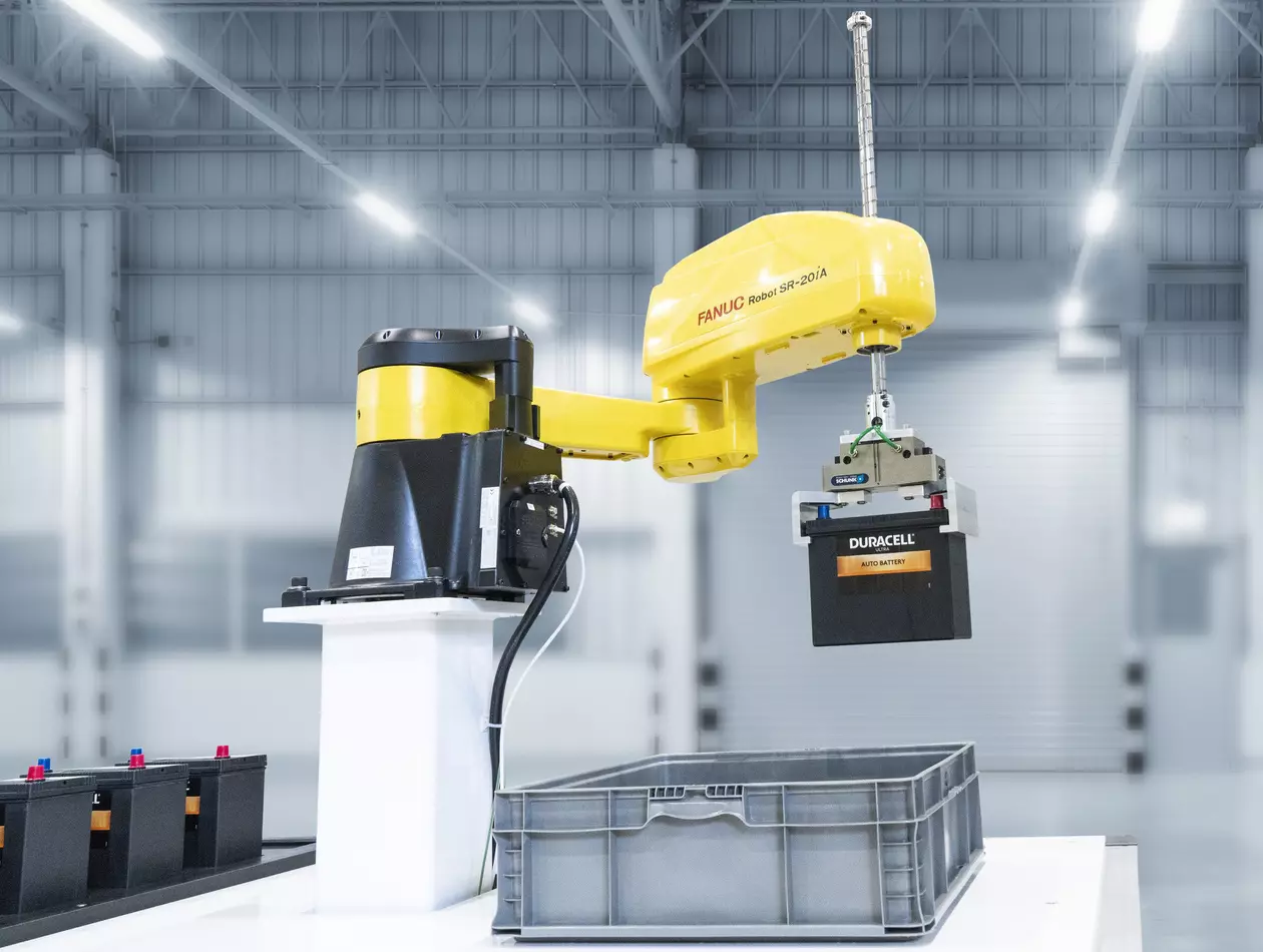 FANUC SCARA SR-20iA handling batteries.