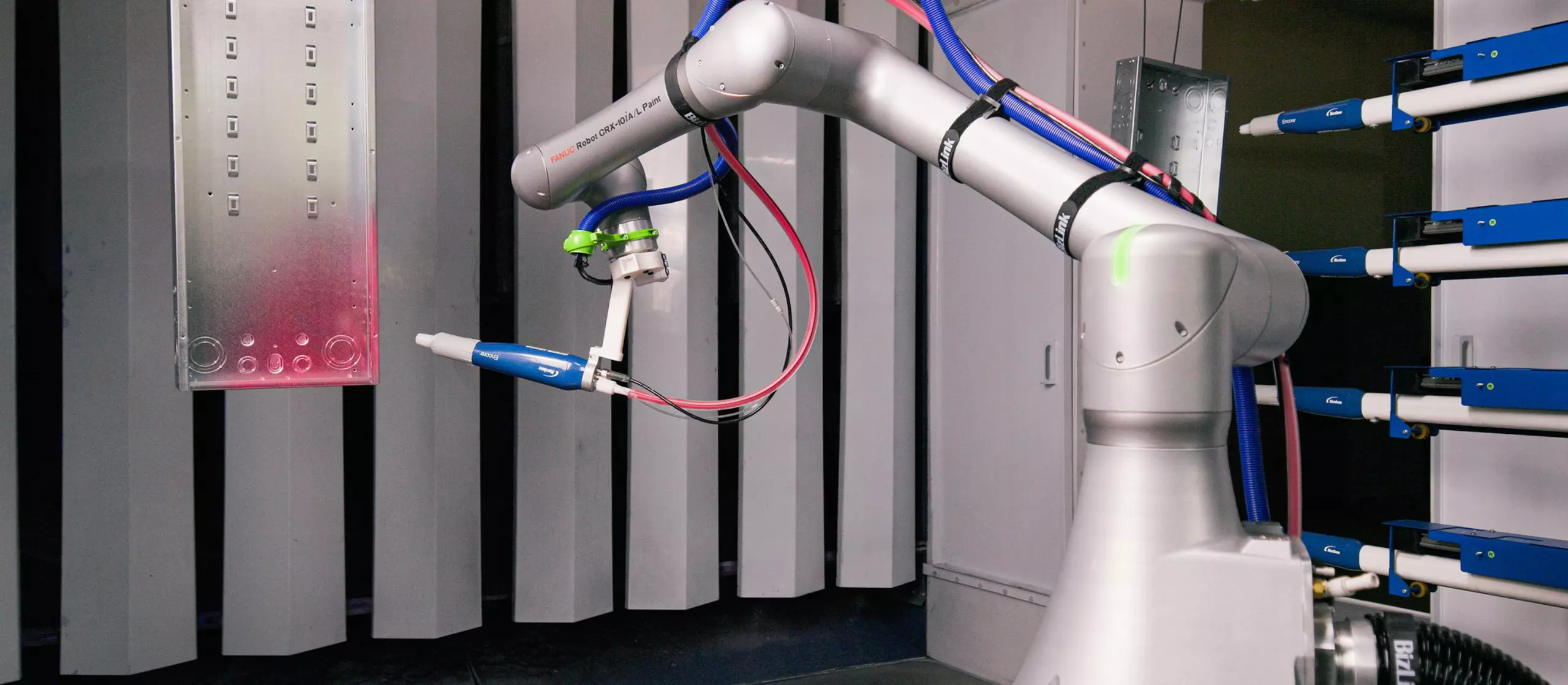 Image of CRX-10iA/L Paint painting an electric panel box.