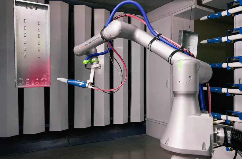 Image of CRX-10iA/L Paint painting an electric panel box.