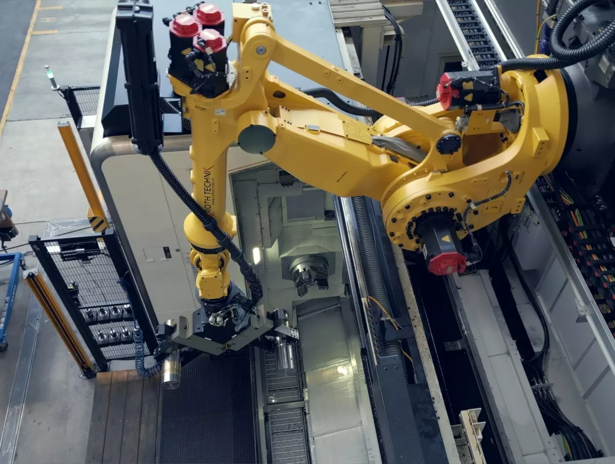 M-900iB/360E mounted on a rail to load-unload machines. Bruderer success story picture.