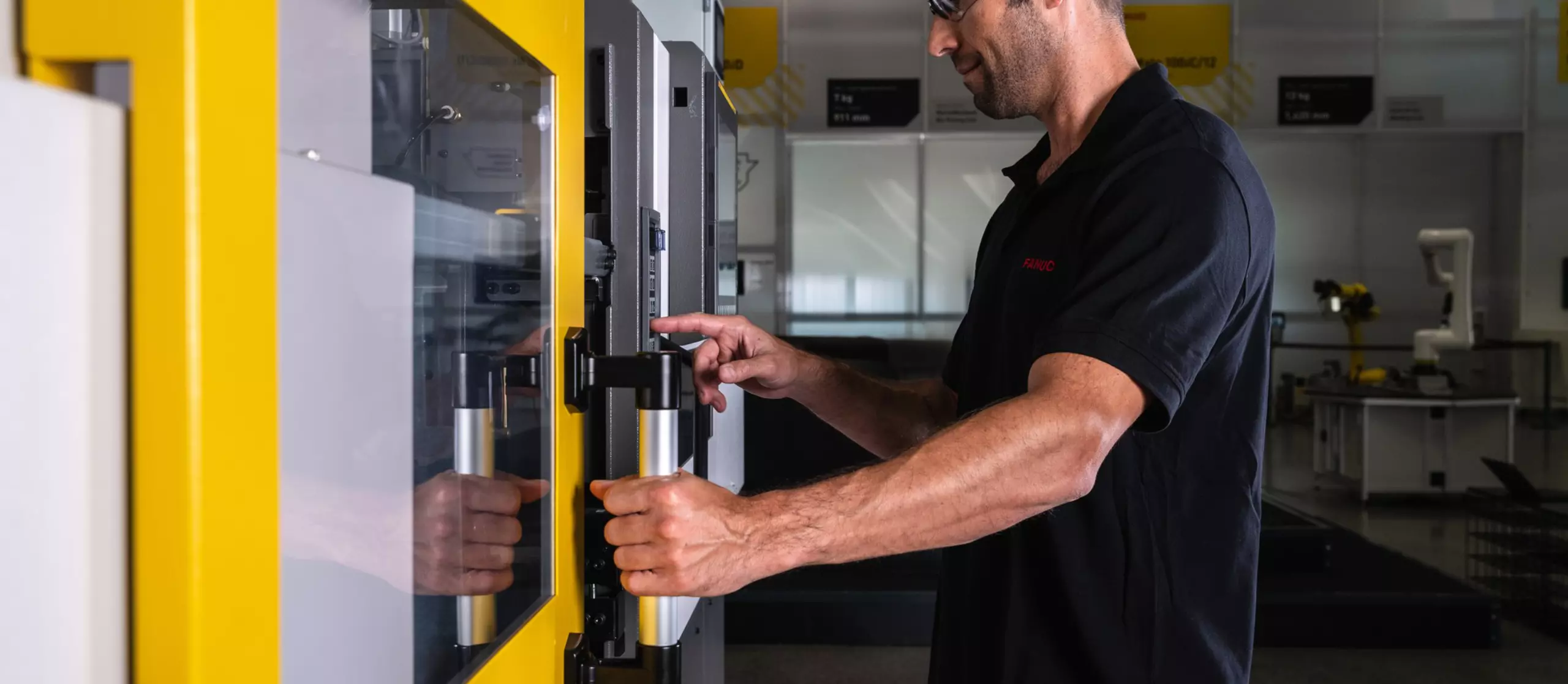 Service / maintenance photo with person. Man checking the inside of a ROBOSHOT machine. High resolution.