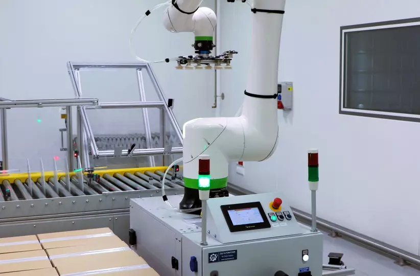 Images case study Phytopharm Klęka S.A from FPL. CRX-20iA/L handles bottle stacks using a custom vacuum gripper, while a CRX-25iA palletises heavy product cartons.