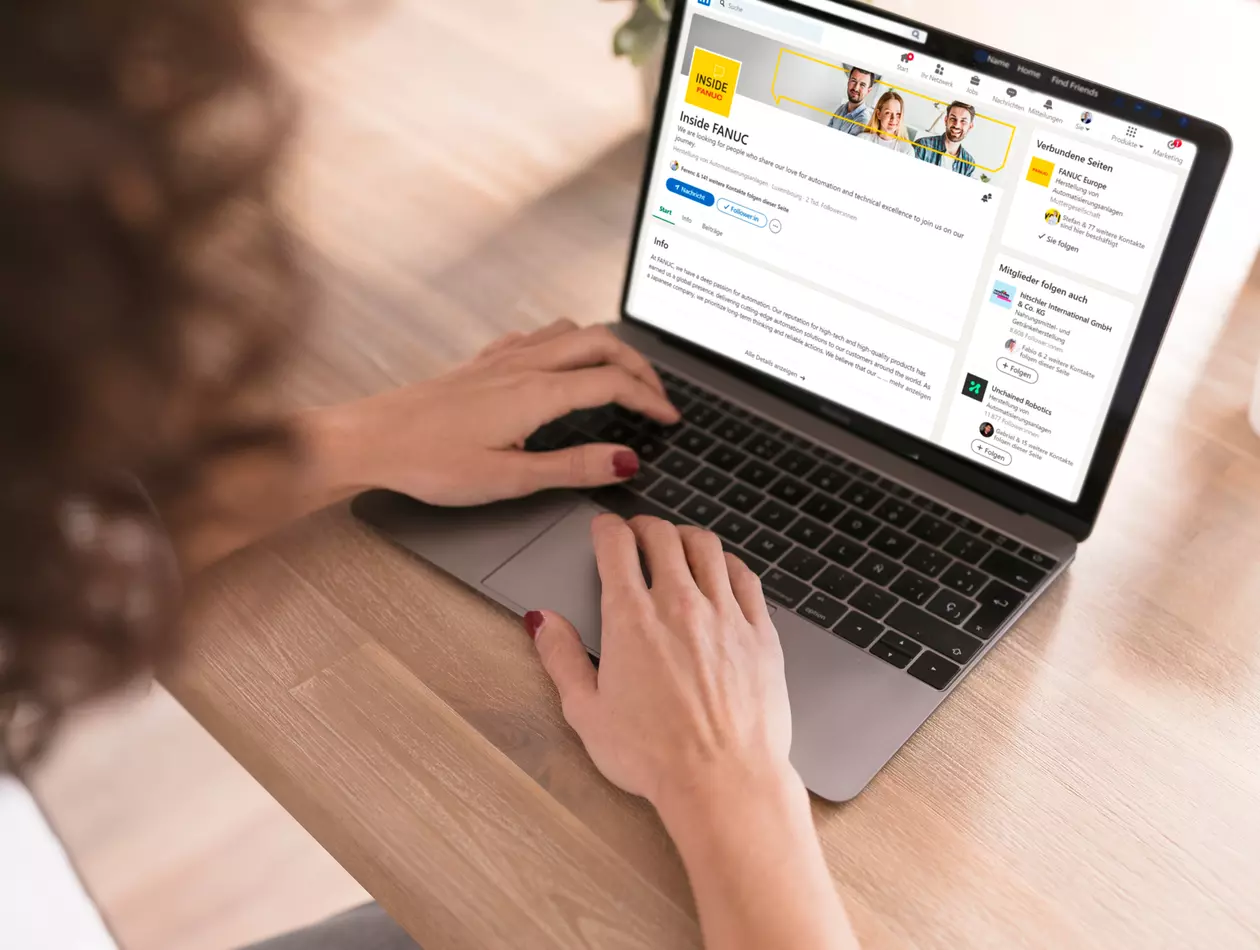 girl with a laptop visting the Inside FANUC LinkedIn Channel
