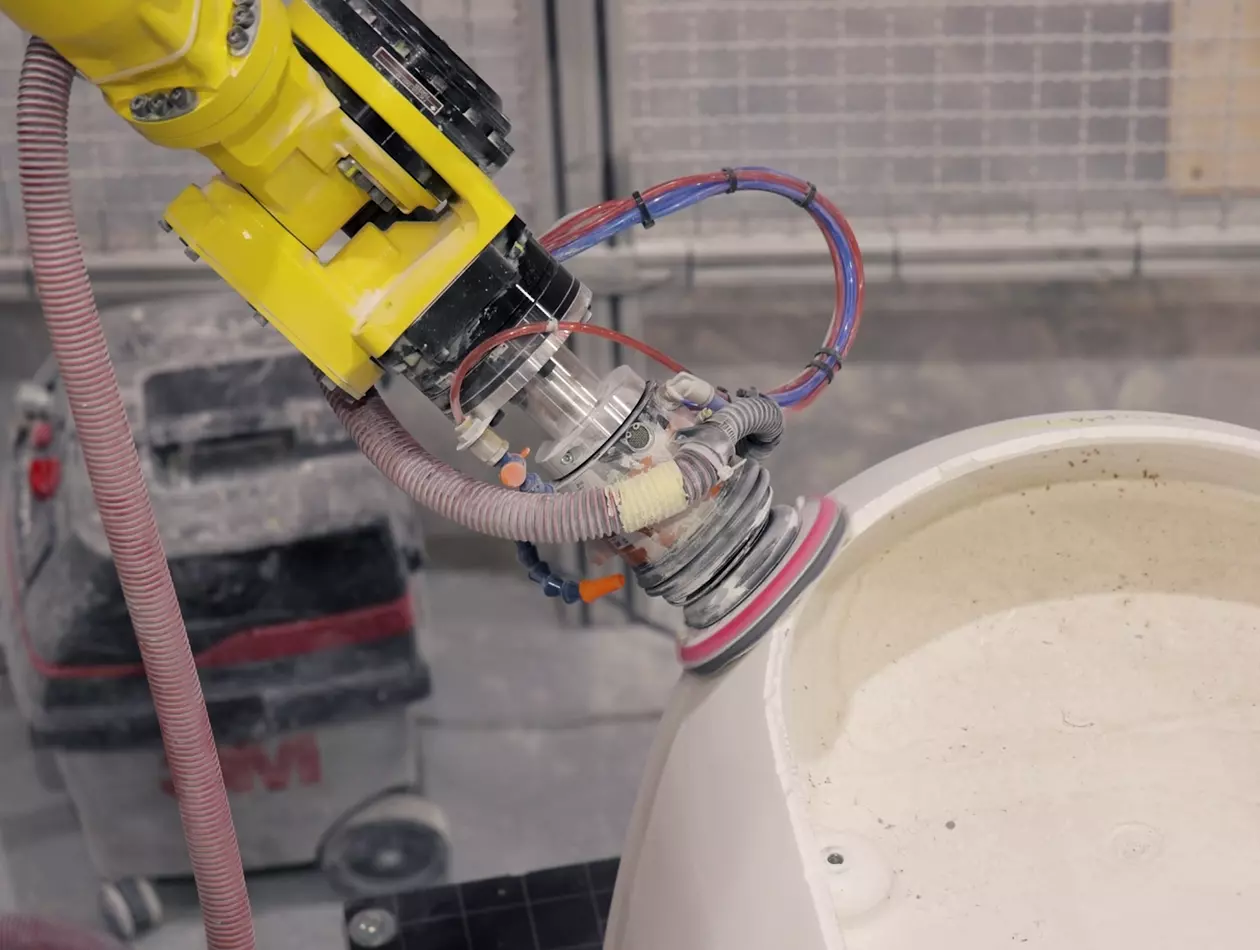 FANUC robot M-710iC/50 performing finishing operations, like grinding and polishing, at Metalac Inko. Installing this robotic cell, multiplied production, ensured repeatable process and with that improved finishing quality.