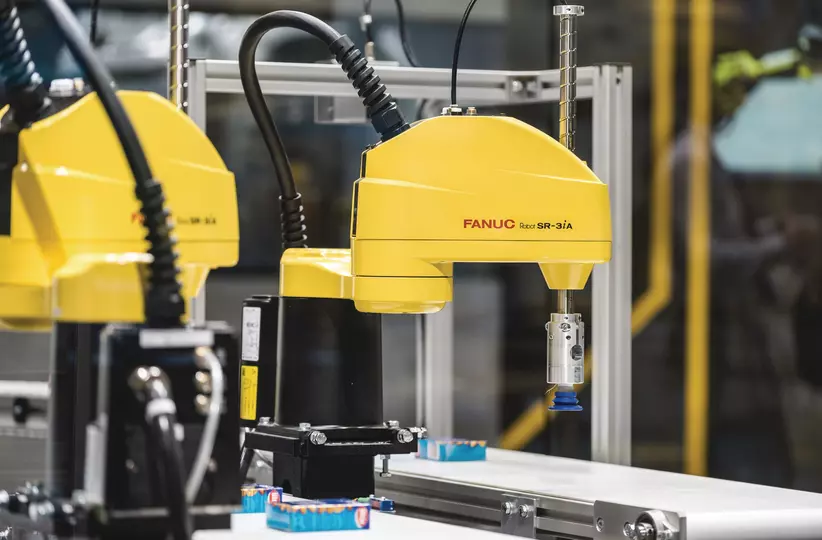 The FANUC SR-3iA robot picking peanuts.