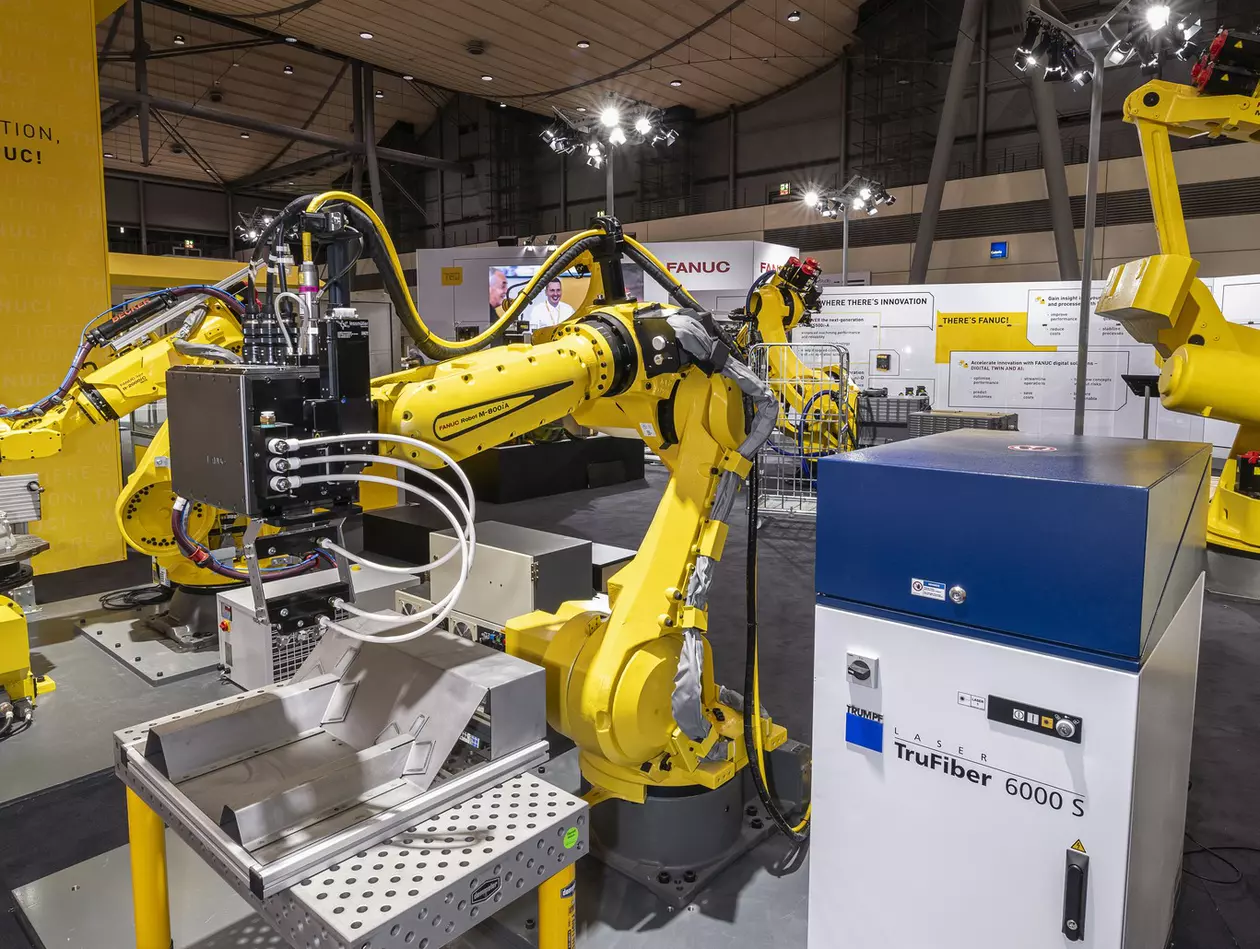 Image of M-800iA/60. EMO Hanover 2023. Application shows Laser welding of sheet metal. High res.