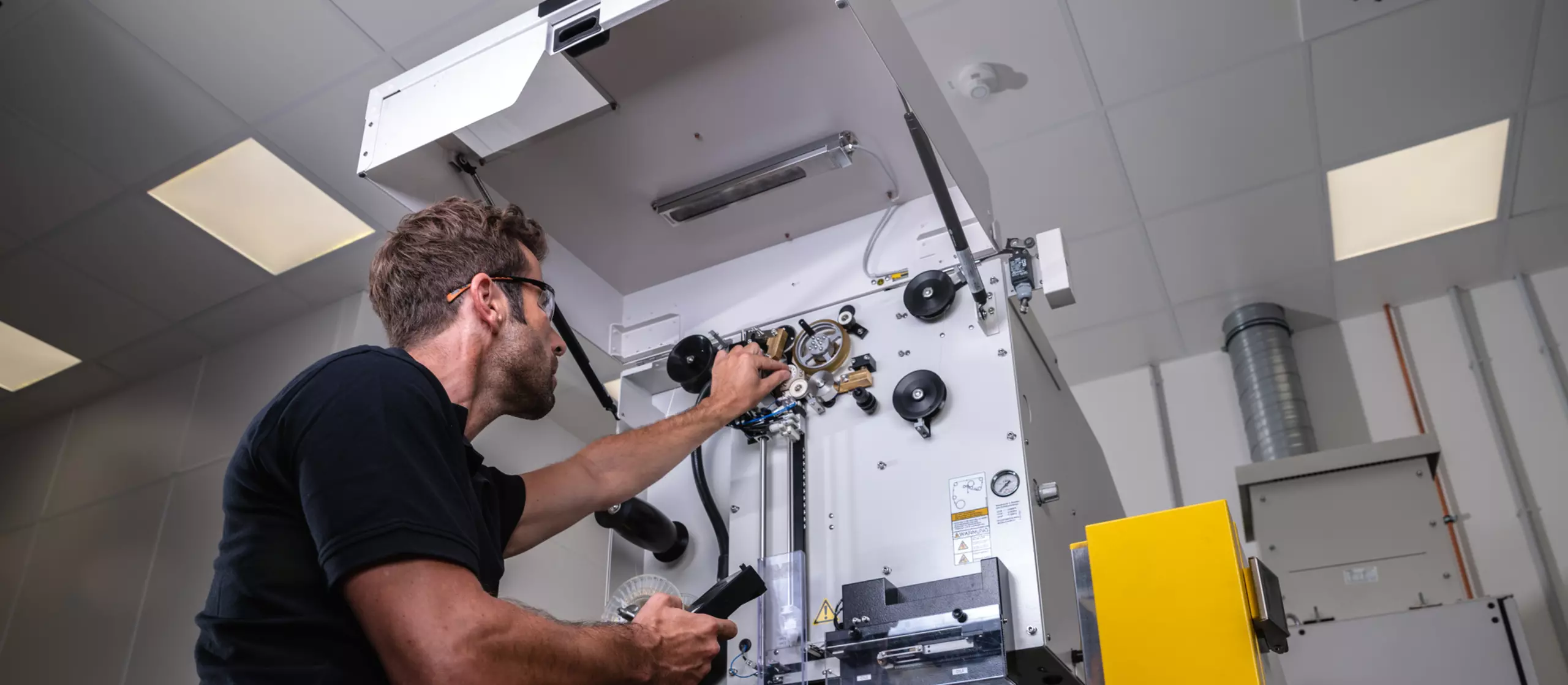 Service engineer is maintaining a FANUC ROBOCUT.