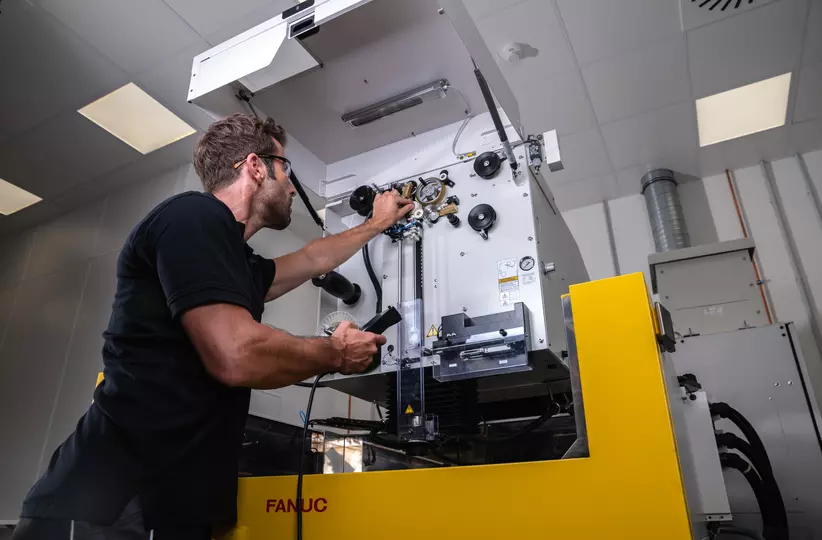 Service engineer is maintaining a FANUC ROBOCUT.