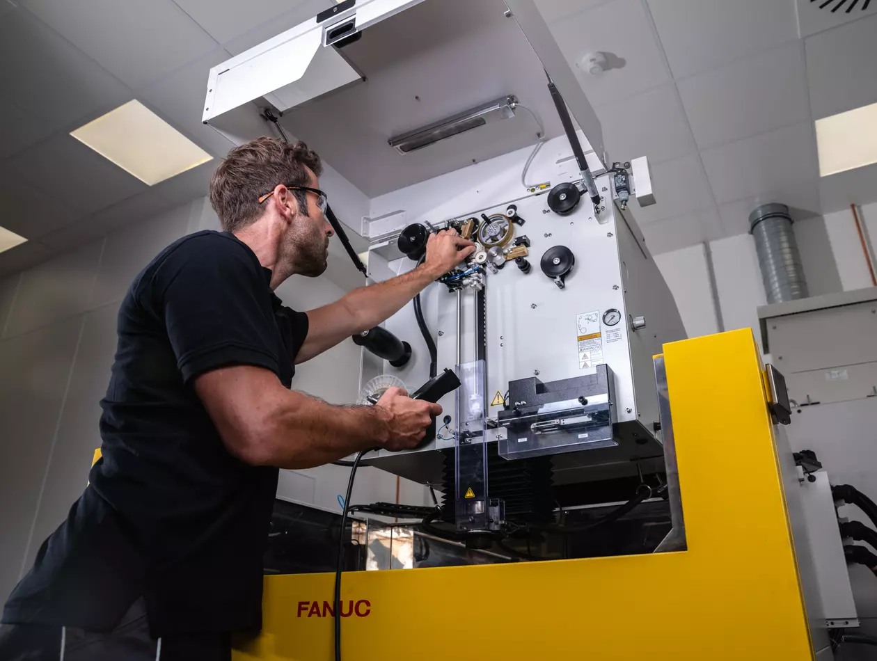 Service engineer is maintaining a FANUC ROBOCUT.