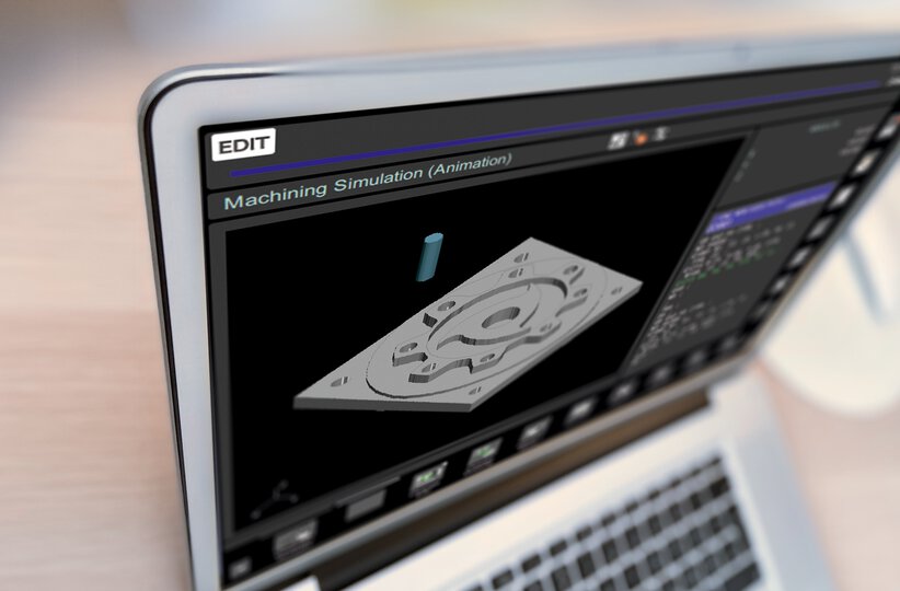 Detail image of laptop with CNC GUIDE. Machine simulation screen