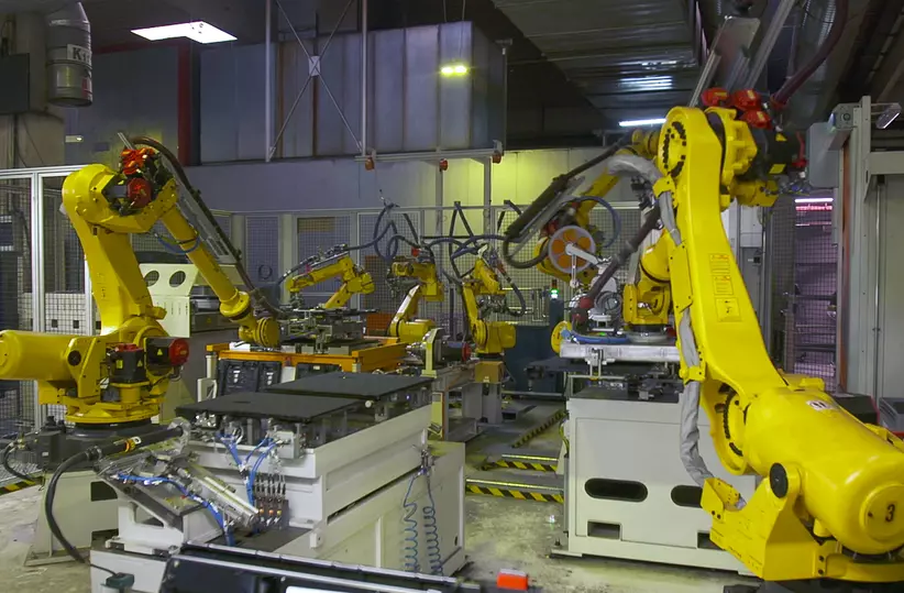 FANUC R-2000iC industrial robot and Arc Mate 100iD arc welding robot boosting the production of car seat structures at Brose Sitech.