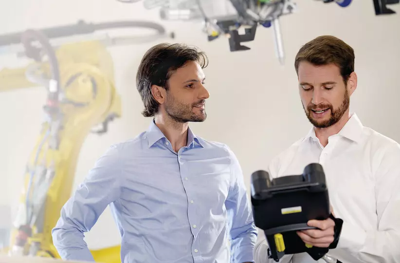 Customer at training with FANUC employee