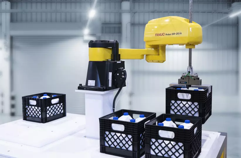 FANUC SCARA SR-20iA handling milk crates.