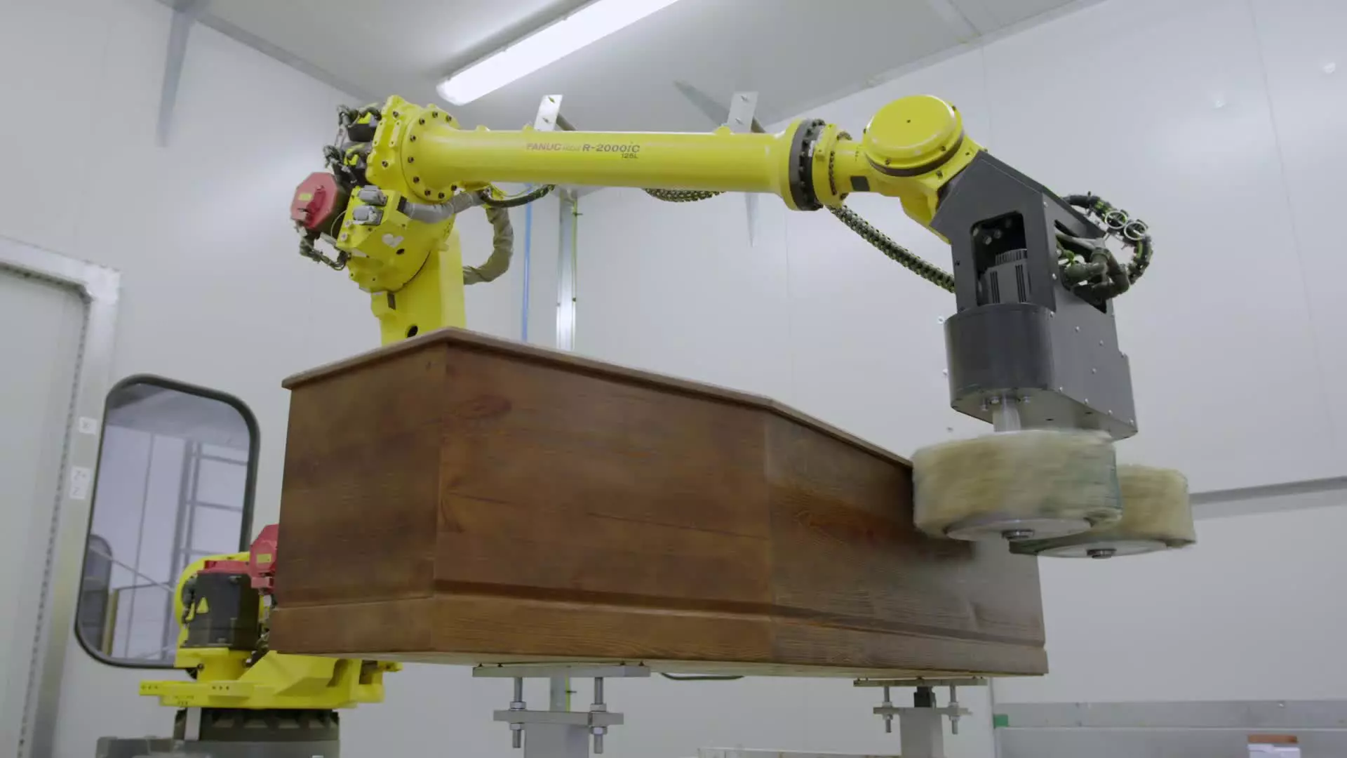 Case study video of Lindner FANUC Poland. Grinding and painting of coffins. Please do not use on social media!