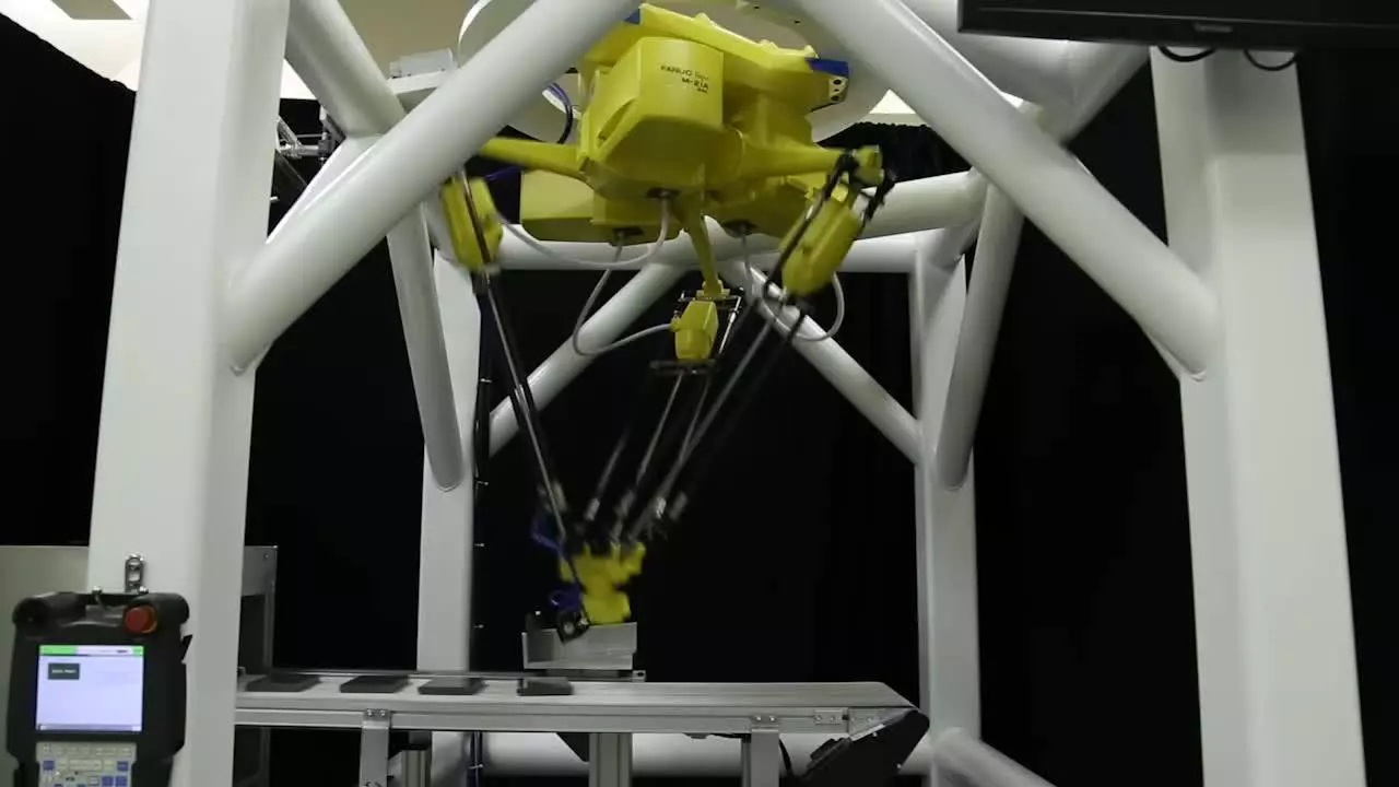 Il robot FANUC M-2iA/3AL assembla le celle della batteria dell'auto con il tracciamento visivo delle linee