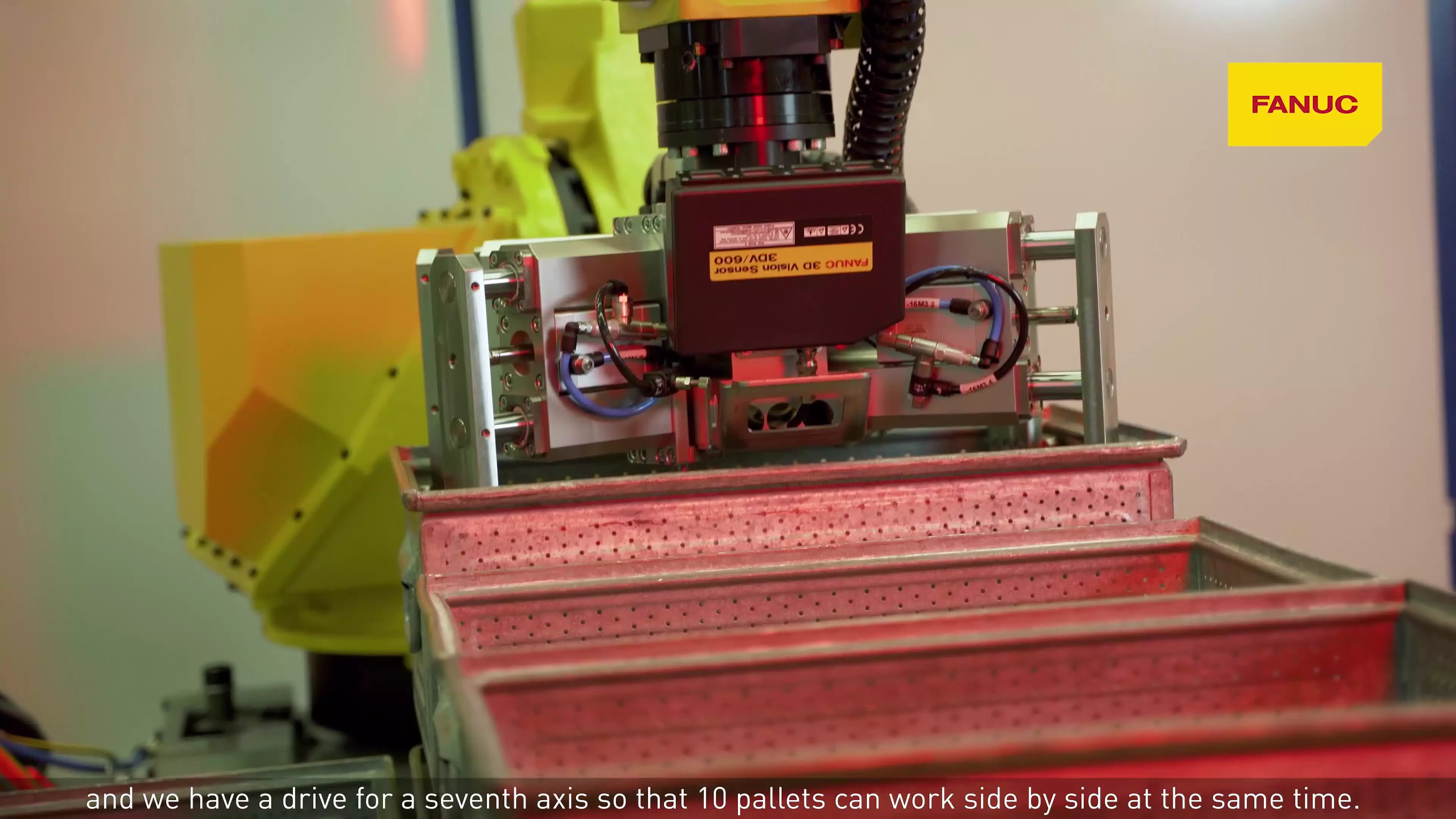 FANUC M-710iC/70 industrial robot combined with a FANUC 3DV/600 3D vision system, which is able to recognise the position of crates and pallets independently, at the Swiss company Heinz Hänggi Stanztechnik.