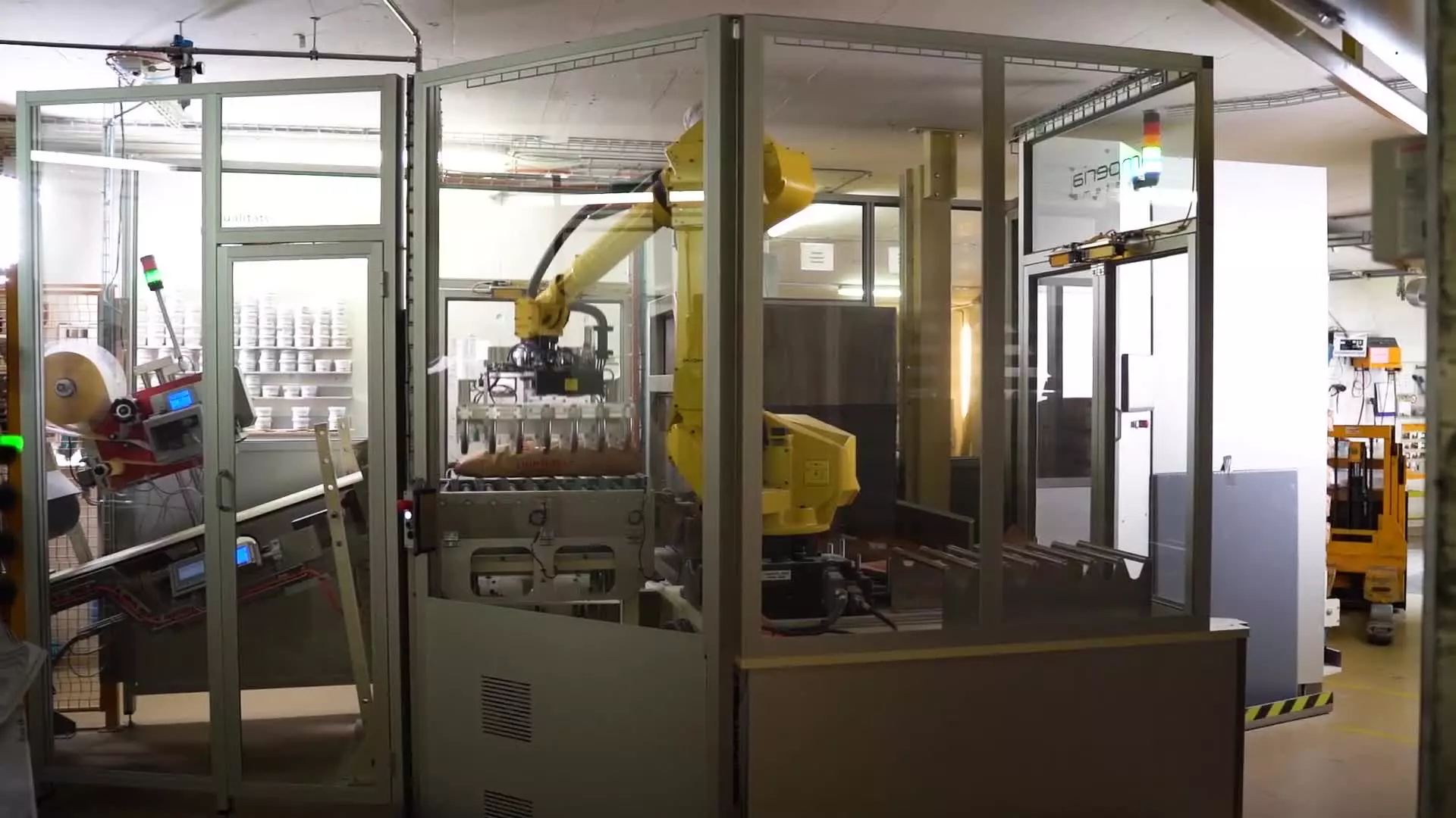 The milling company Lindmühle in Birmenstorf (CH) was looking for an automated solution where 5 to 25 kg bags of flour are stacked automatically in a visually beautiful way and each bag is weighed.

They are bagging 20-25 tons of flour every day, which were stacked on the pallets by hand until now. Their employees are relieved by this robot, it is less physically demanding and they were able to increase the bagging capacity, respectively the palletising capacity, to 35 tonnes. With the help of the robot, this capacity can be expanded even further.

The big challenge in the project was the (non-) available space. Not only the footprint but also the height of 2.90m. With the help of the ROBOGUIDE simulation software from FANC, they were able to simulate the most diverse robot options in the quotation phase, check the cycle time and then select the most suitable robot for.

In the progress of the project, they realised that an additional servo-controlled axis was necessary for clean depositing and stacking of the flour sacks. Since additional axes can be implemented very easily with FANUC, their programmers were able to put them into operation in very few hours.